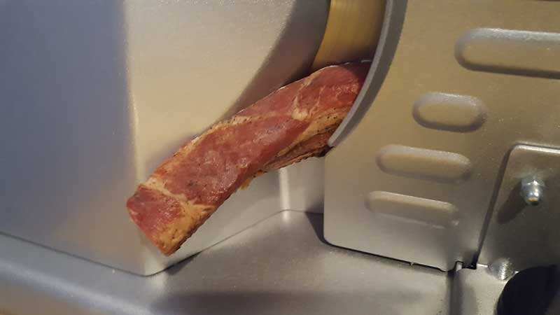 Slicer making thick bacon slices