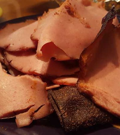 Sliced barbecued bologna.