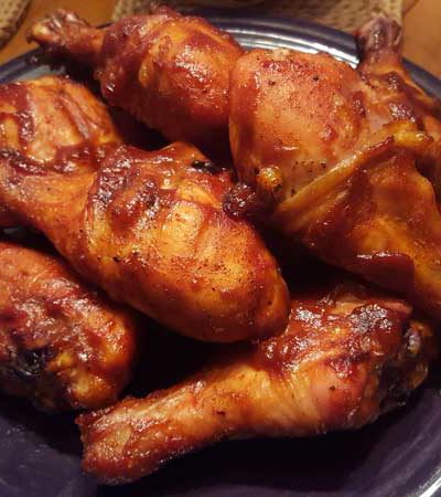 Barbecue chicken thighs on a plate.
