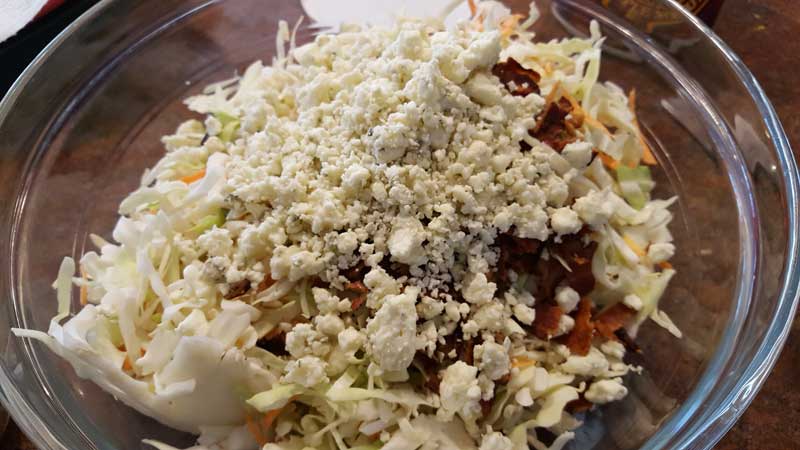 Cole slaw ingredients in a bowl.