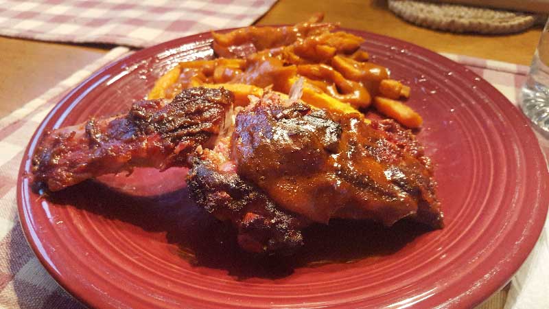 Baby back ribs on a plate.