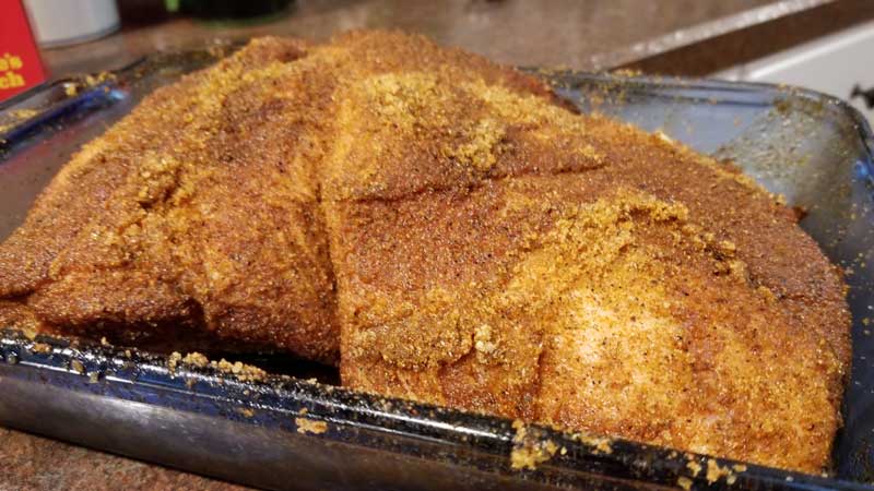Pork Butt with rub on it.