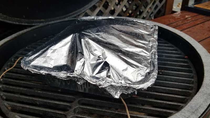 Aluminum pan covered by aluminum foil on the Big Green Egg