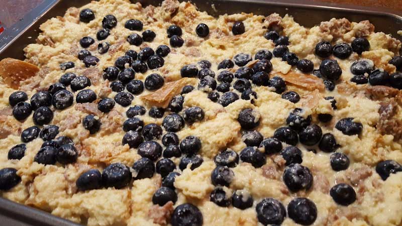 French toast mixture with blueberries spread across.