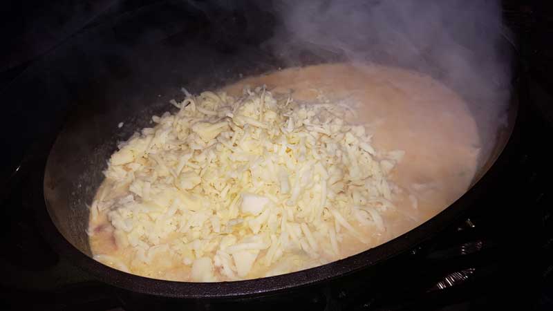 Cheese added to the Dutch oven.