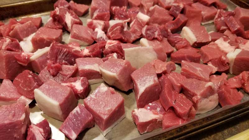 Meat cut into cubes.