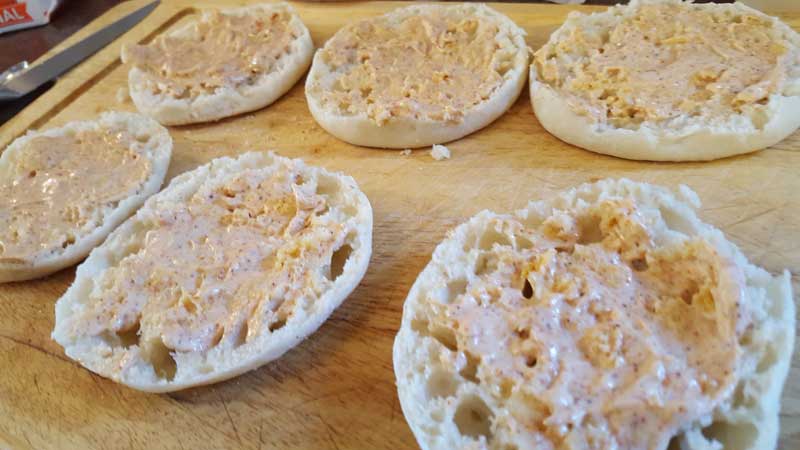 Mayonnaise mixture spread on English Muffins.