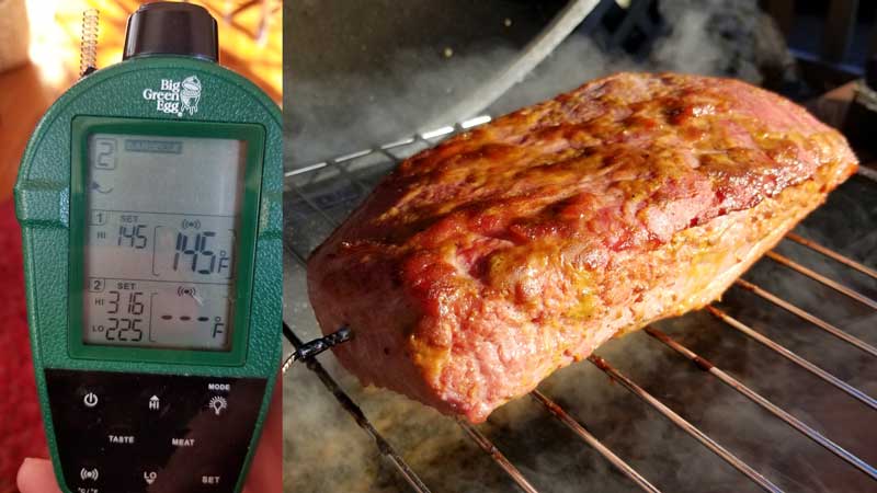 Temperature monitor reading 145 degrees next to a cooked corned beef.
