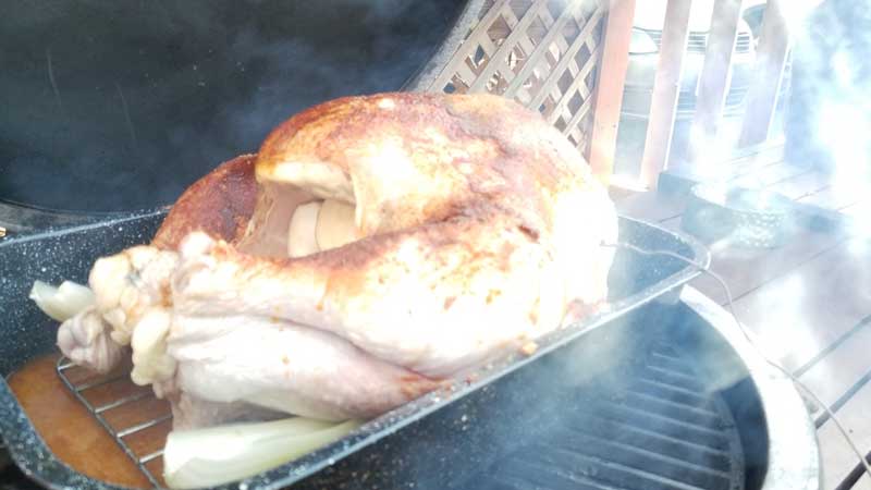 Uncooked turkey on the Big Green Egg.