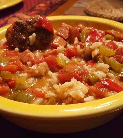 Gumbo over rice in a bowl.