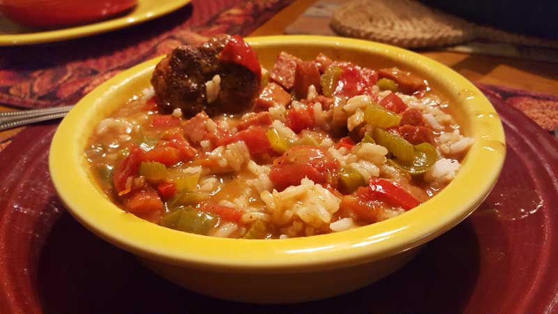 Gumbo over rice in a bowl.