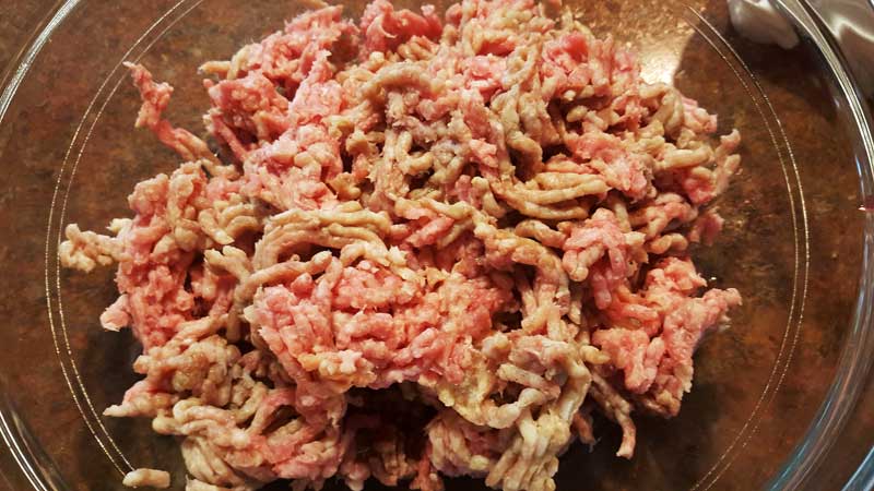 Meatloaf mix and ground beef in a bowl
