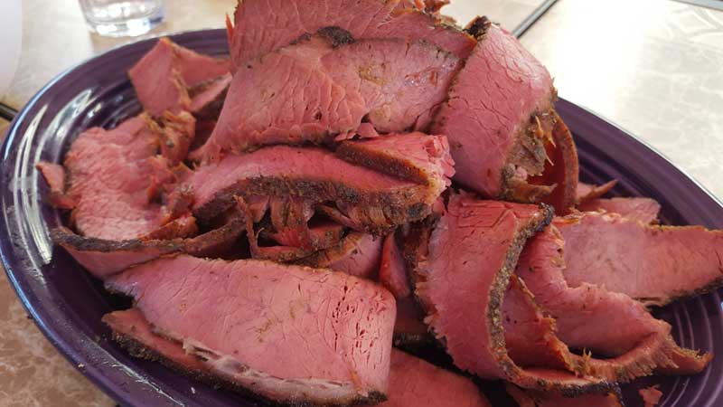 Plate of sliced pastrami.