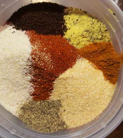 Looking down into a tupperware of spices.