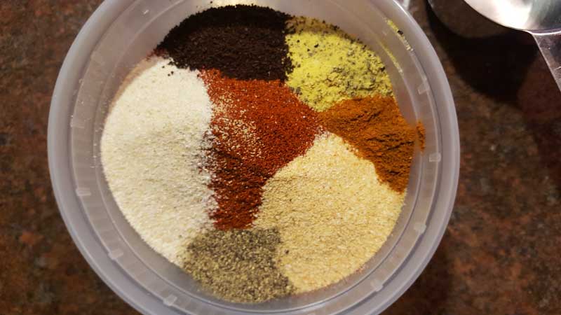 Looking down into a tupperware of spices.
