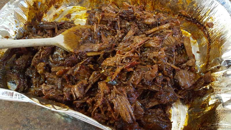 Shredded meat mixed with the sauce.