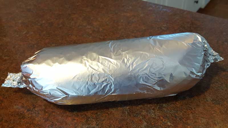 Tortilla wrapped in aluminum foil.