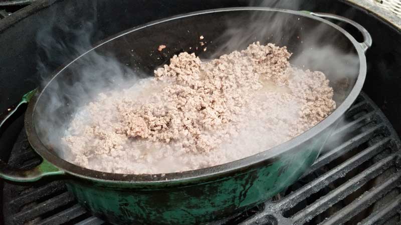 Meat browning in a Dutch oven.