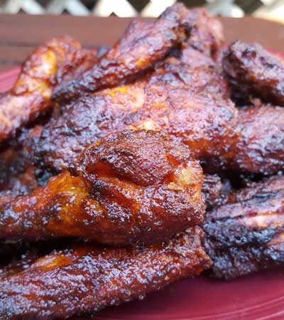 Barbecued wings on a plate.