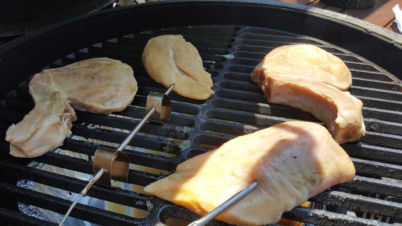 Chicken and pork on the Big Green Egg.