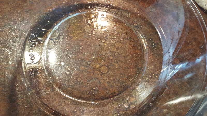 Water and oil in a bowl.