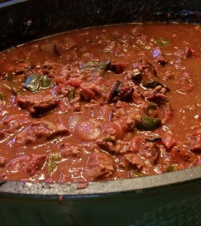 Chili in a Dutch oven on the table.