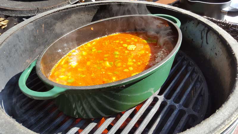 Broth and tomatoes added to the dutch oven.
